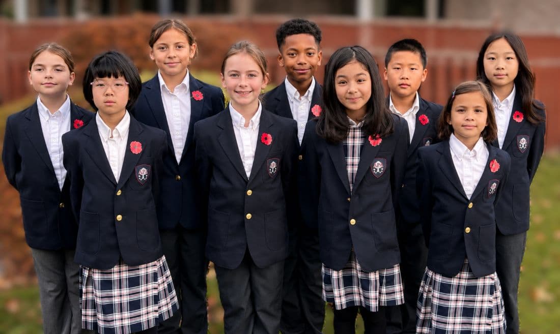Aurora Preparatory Academy students in uniform outdoors